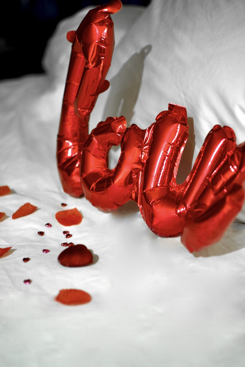 Red Plastic Balloon on White Textile