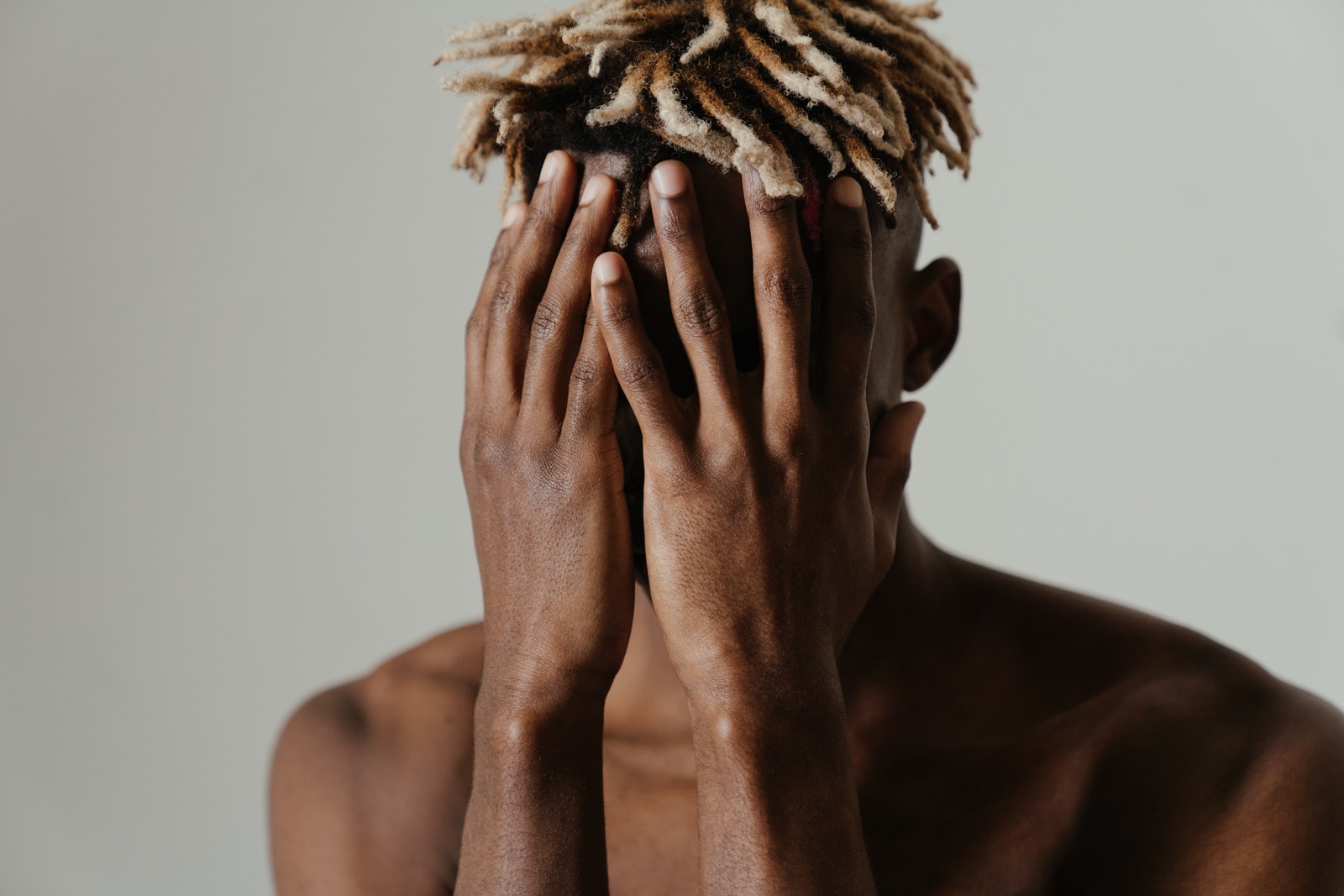 Woman Covering Her Face With Her Hands