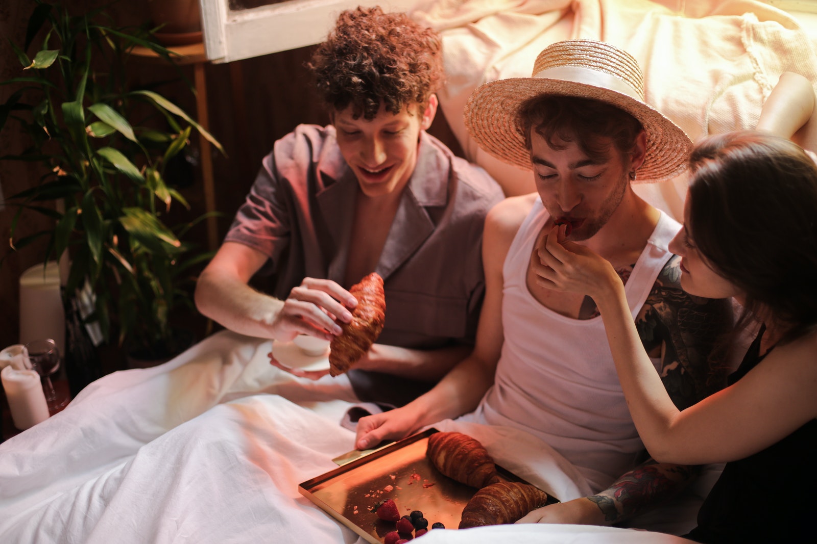 Man in White Tank Top Sitting Beside Woman in White Tank Top