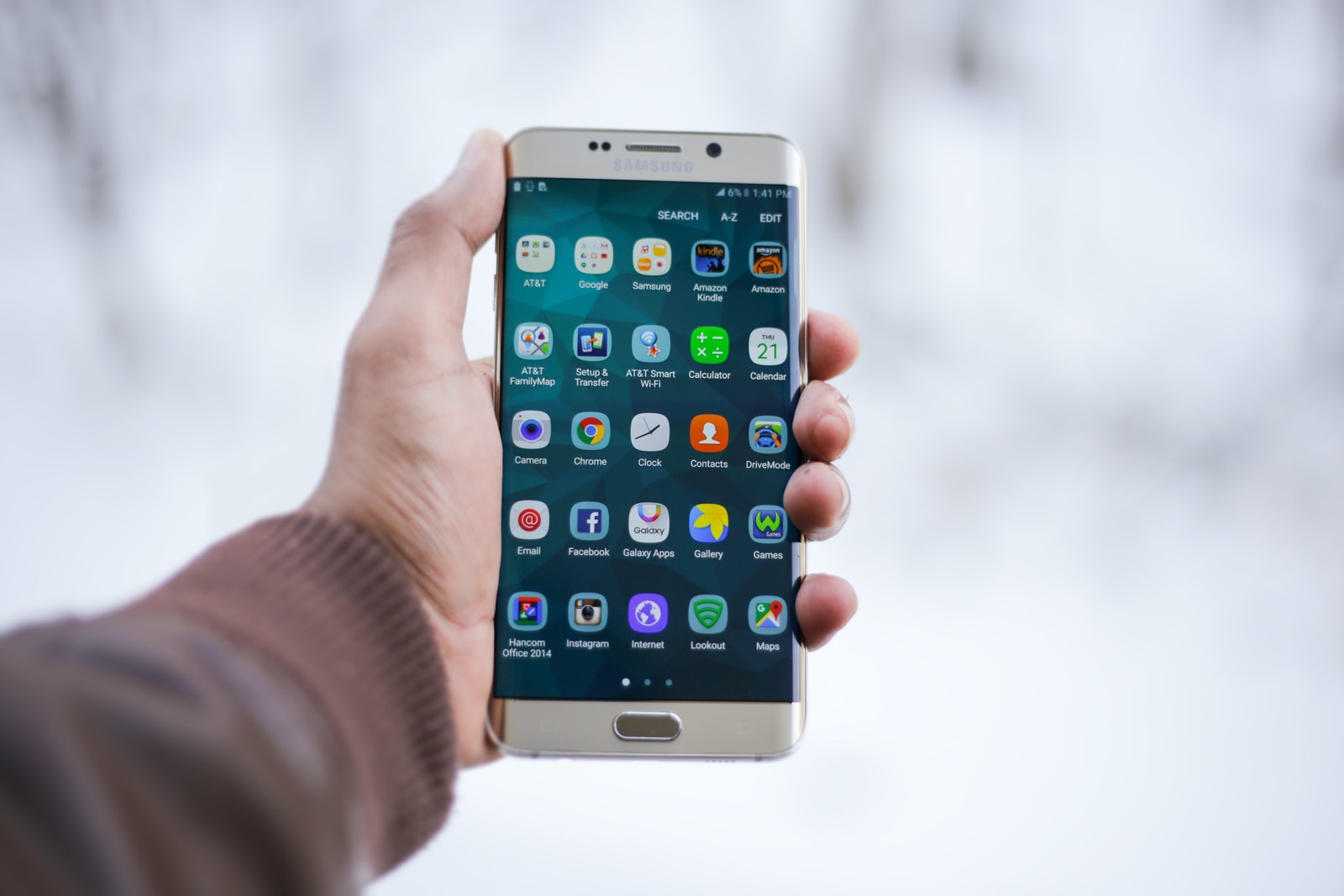 Person Holding Silver Android Smartphone