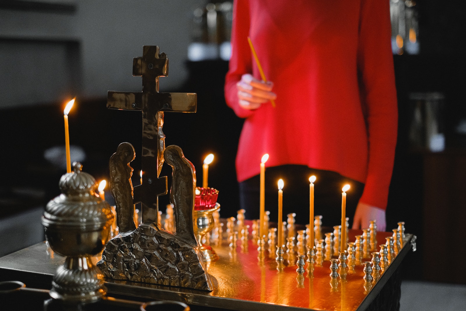 Gold and Silver Cross on Table