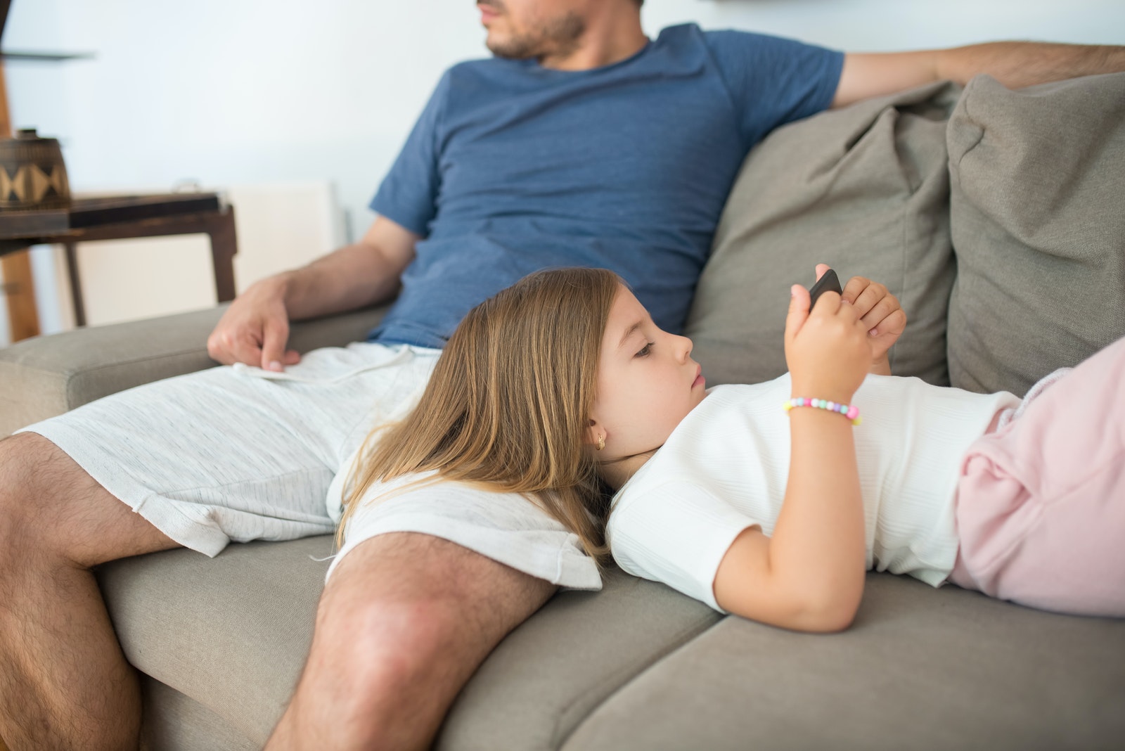 Photo of a Child Watching on a Cell Phone