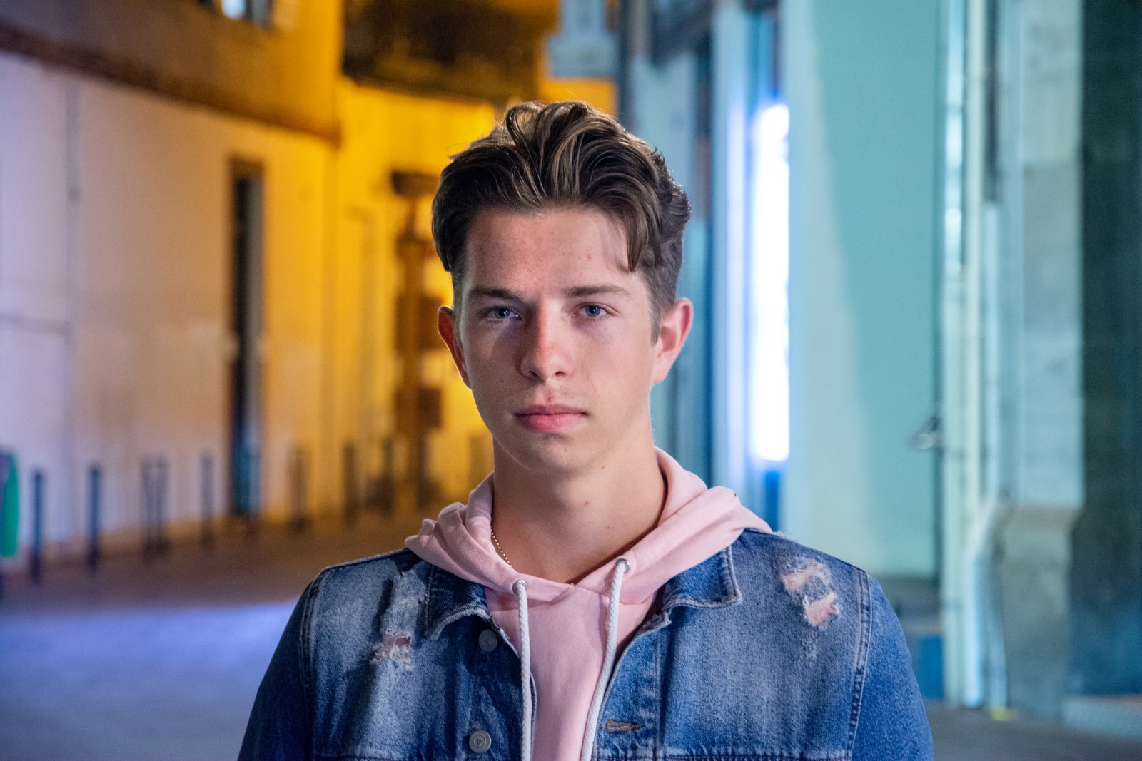 man in blue denim top inside room